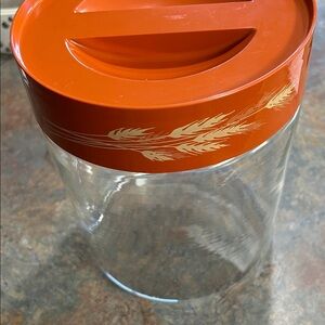 Pyrex glass cannister with Autumn Harvest Wheat pattern lid.